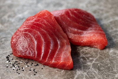 two raw wild yellowfin tuna steaks