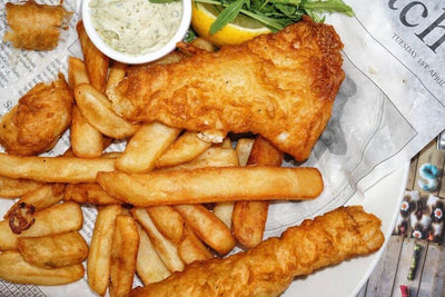 fish and chips with two fried new england haddock fillets and fries