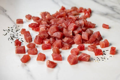 one pound of raw yellowfin tuna poke on a marble table