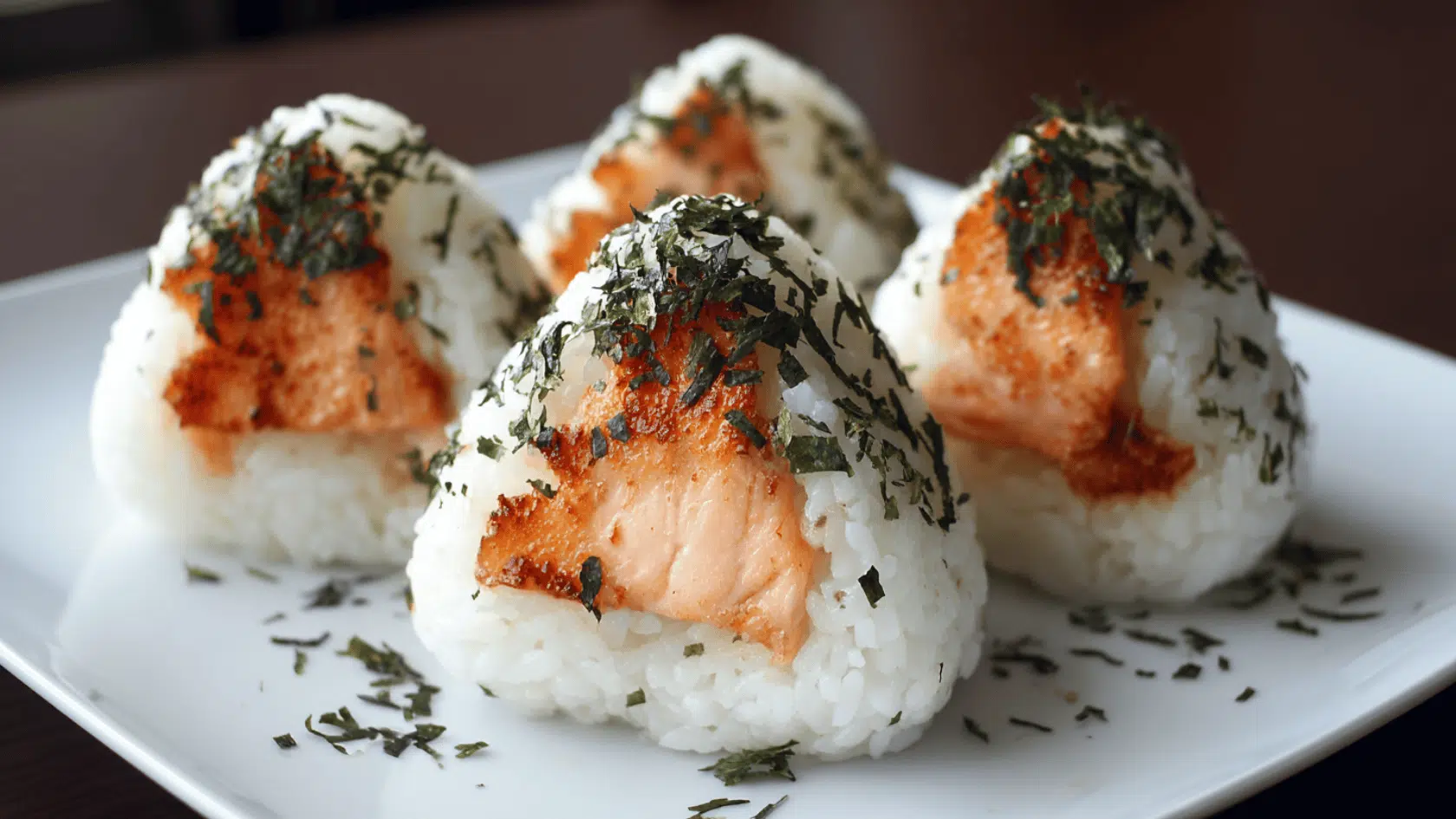 Close-up of sushi adorned with contrasting black and white stripes, showcasing a modern culinary presentation