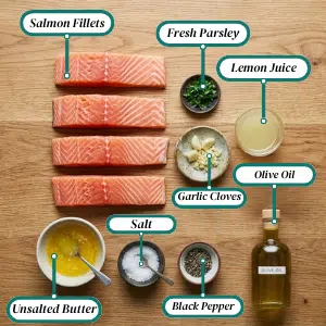 _Ingredients for garlic-butter skillet salmon displayed on a wooden table, including garlic, butter, and fresh salmon fillets