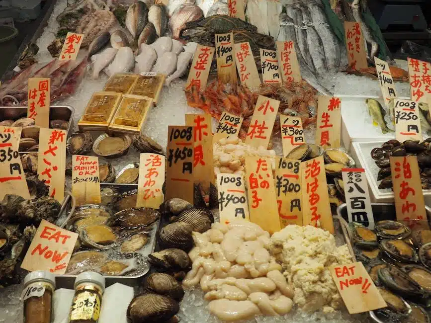 Variety of fresh seafood arranged on ice display at a market